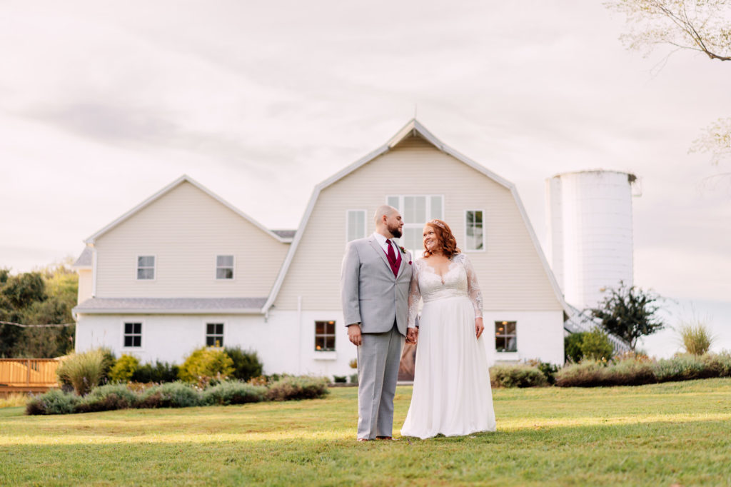 bride and groom wedding portrait in front of their wedding venue in Leesburg Virginia