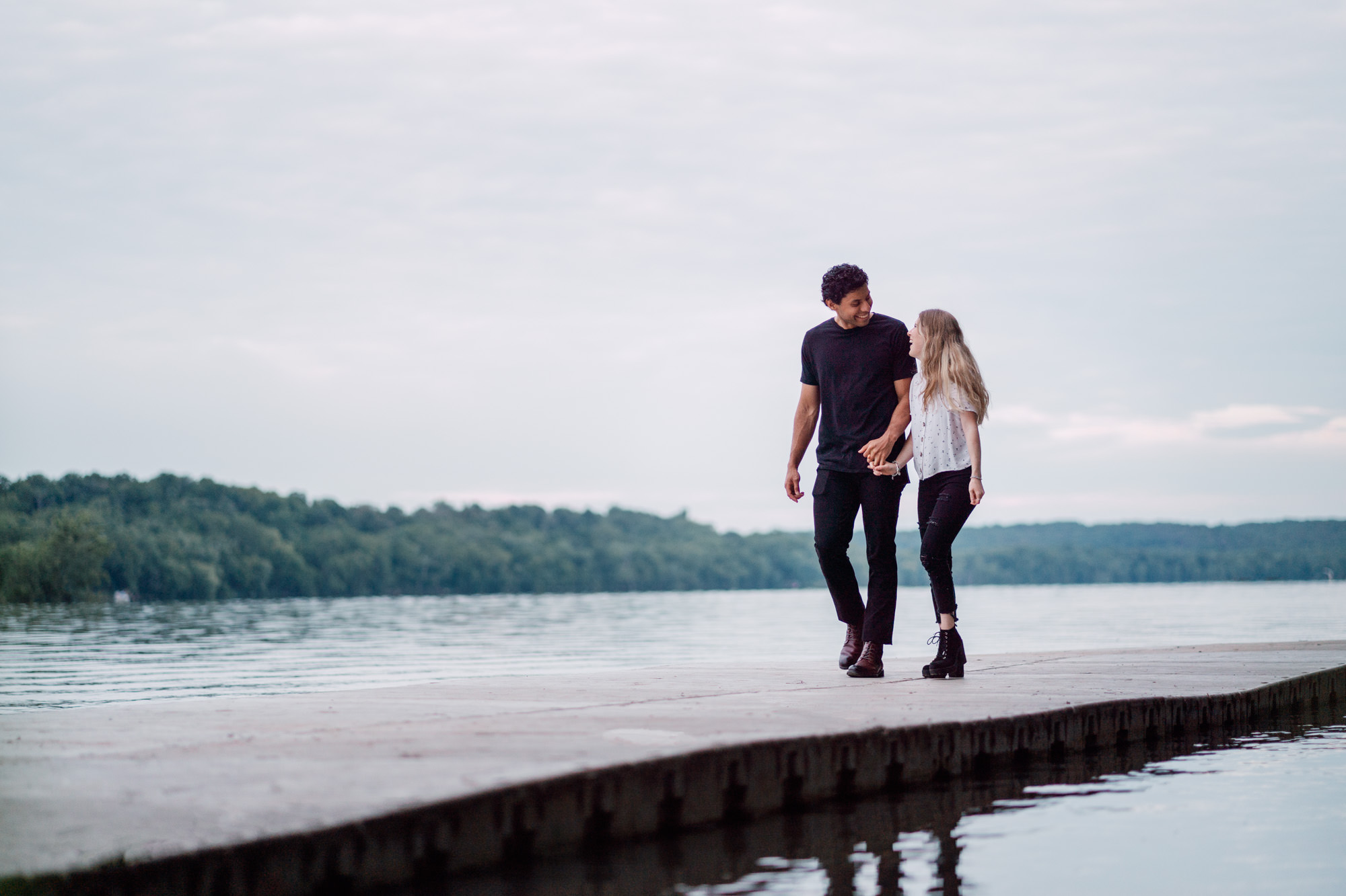 couple walking together on dock near algonkian regional park in sterling virginia