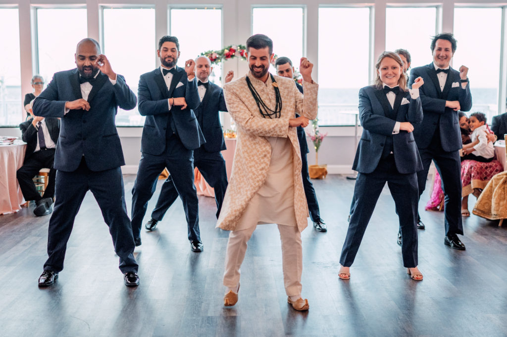 groom performing choreographed dance for bride