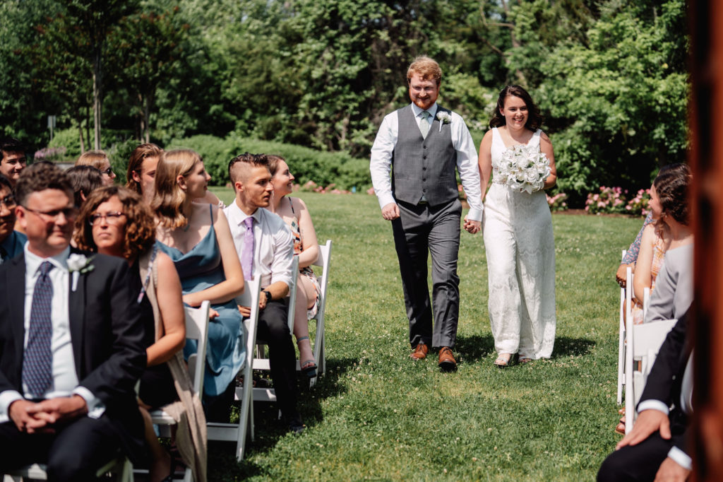 bride and groom walking down the aisle together for their northern virginia wedding ceremony