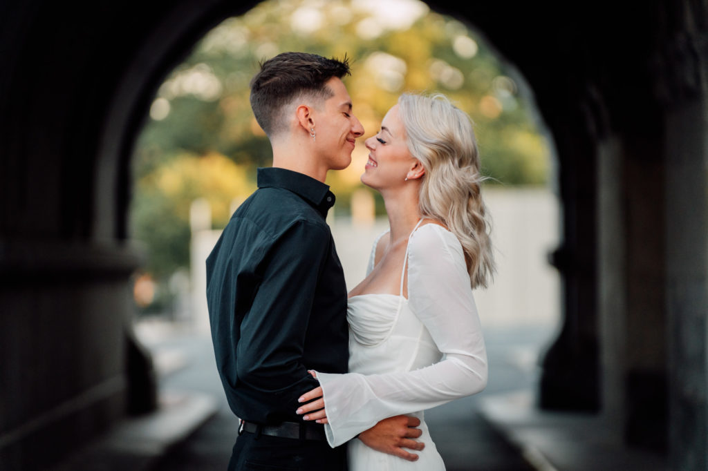 couple smiling at each other during engagement session at the library of congress