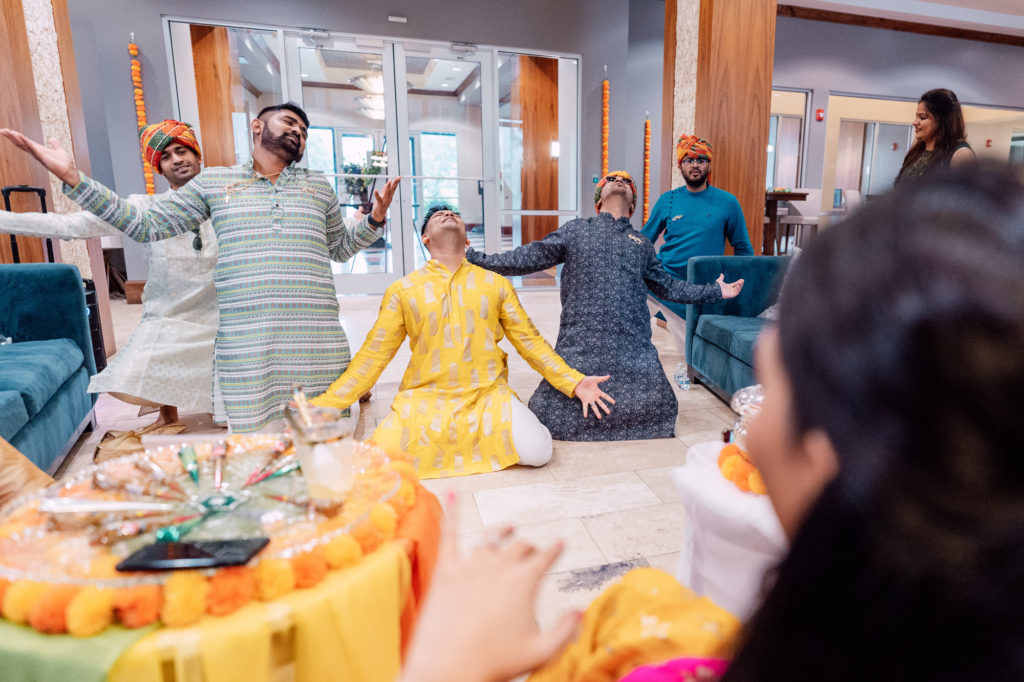 groom and friends completing their indian tribute dance