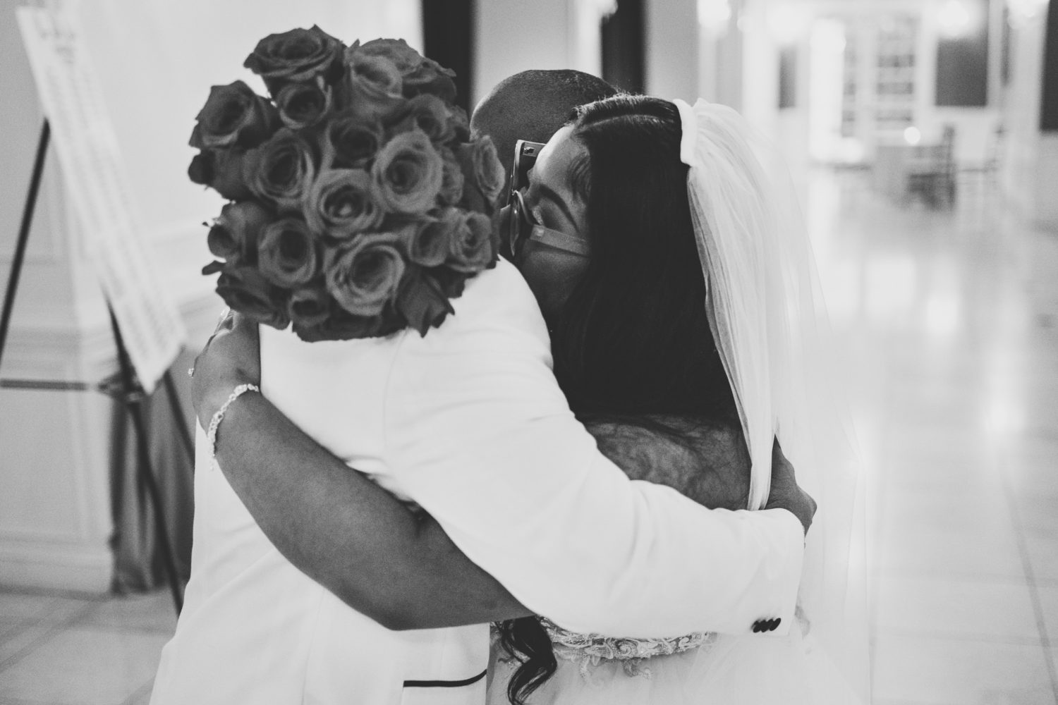 bride and groom hugging after their wedding ceremony finished