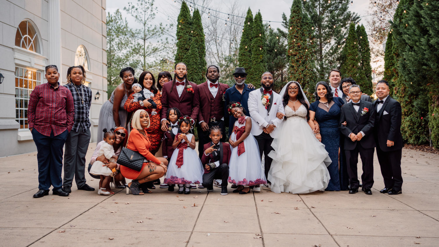 family portrait of bride and groom families