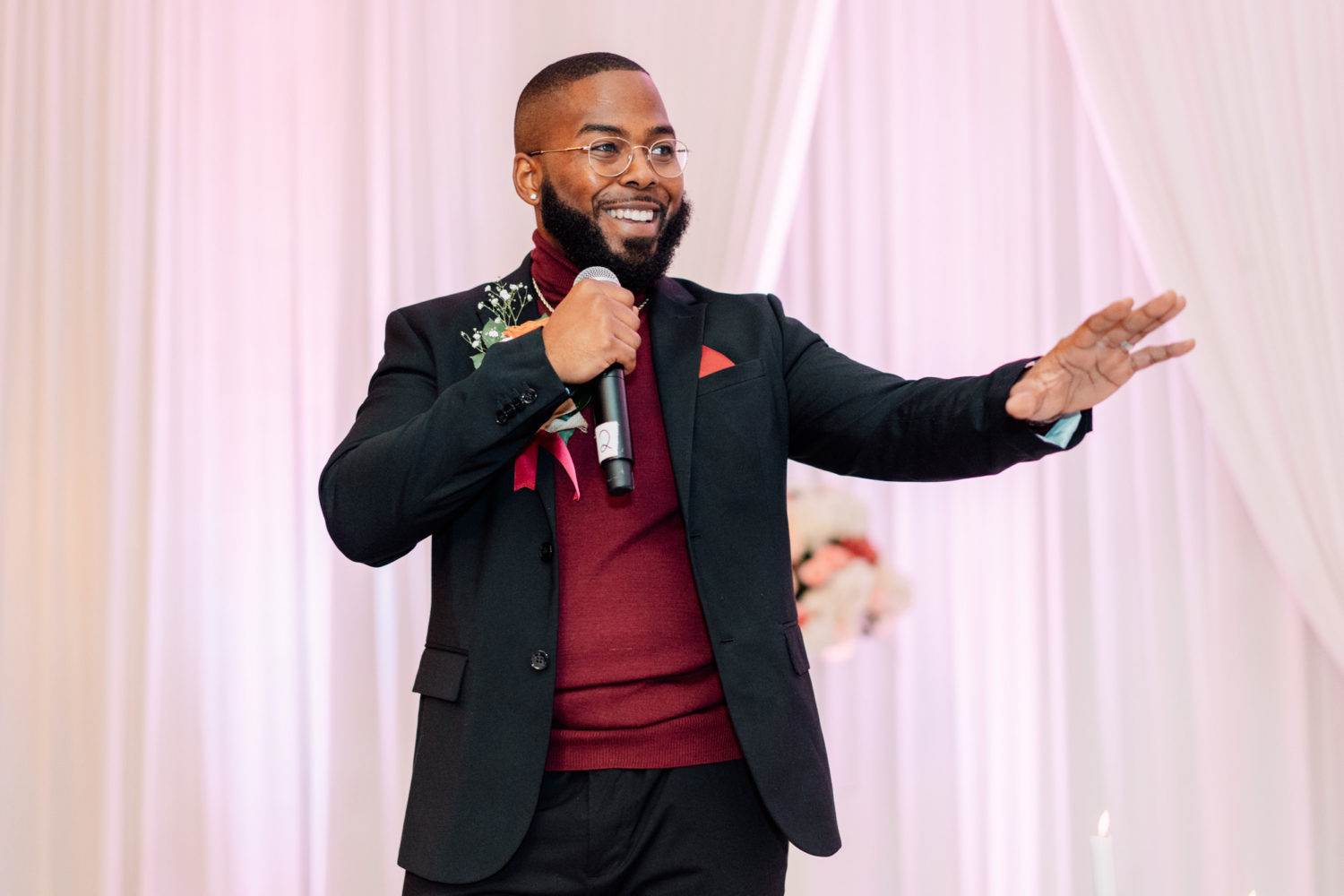 groom having fun and smiling while giving a speech on his Foxchase manor wedding day