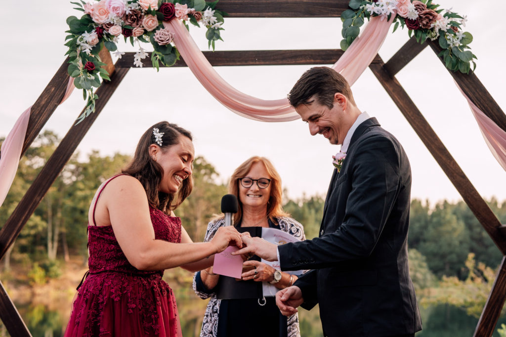 bride and groom ring exchange during wedding ceremony in Northern Virginia