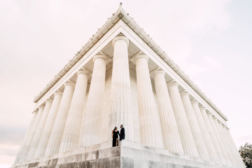 couple interacting during lincoln memorial engagement photography session