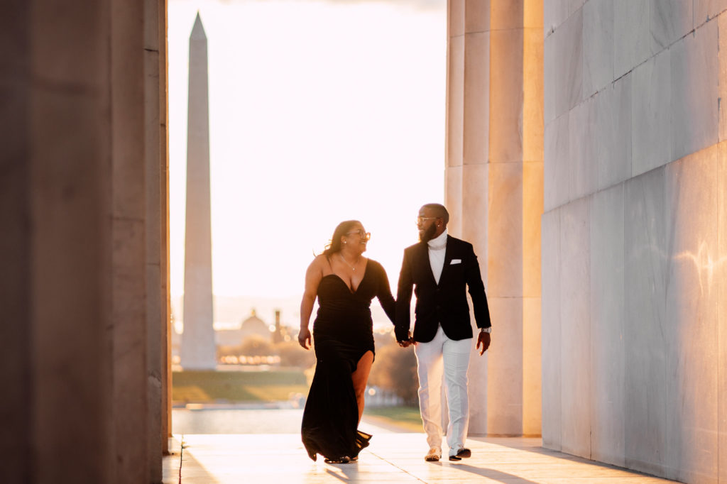 couple walking while at the Lincoln memorial monument in washington dc