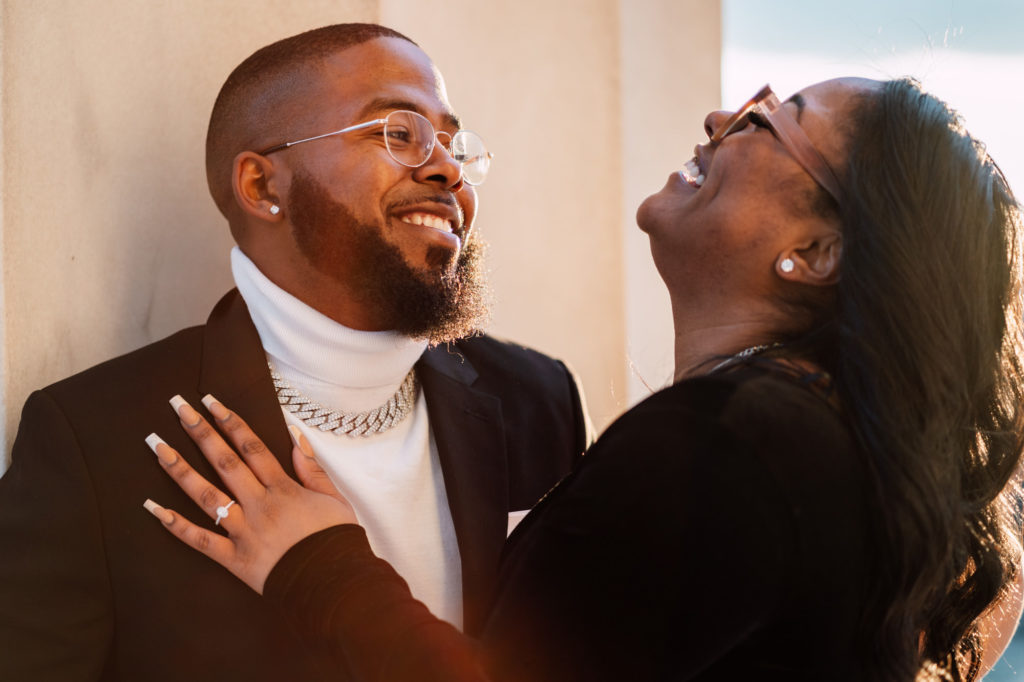 couple laughing together during engagement photography session