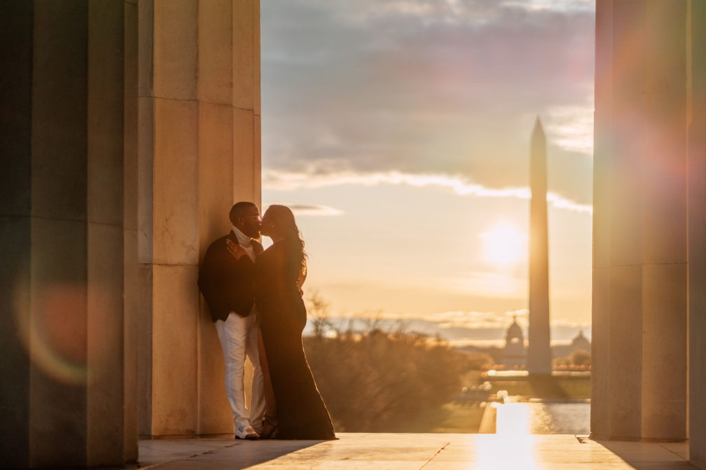 couple kissing during sunrise engagement photography session in washington dc