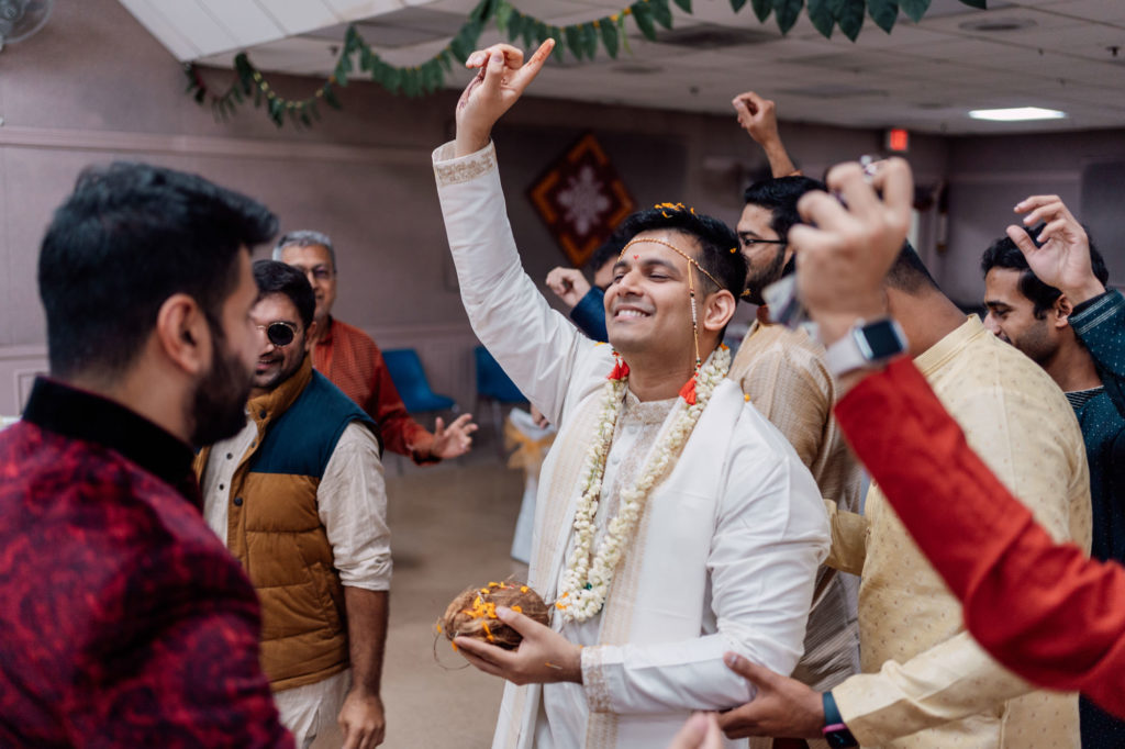 indian groom enjoying arrival celebration