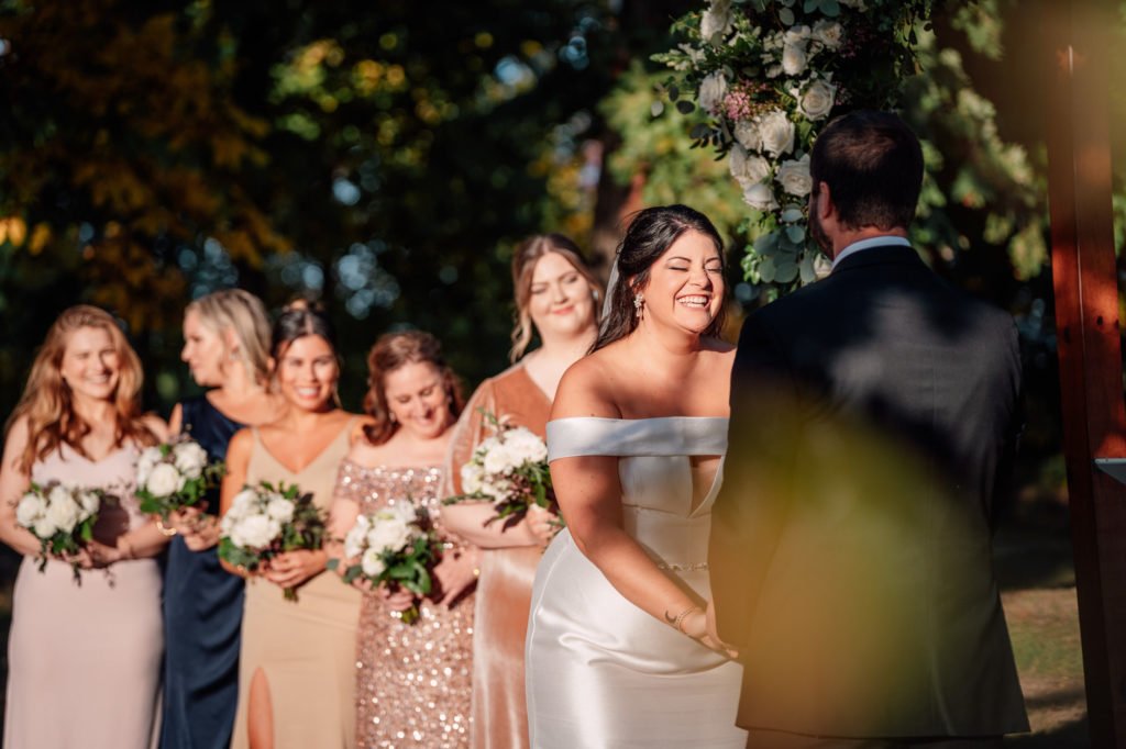 bride laughing during her harvest house at lost creek winery wedding ceremony