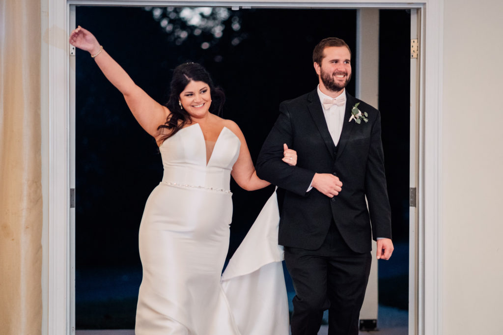 bride and groom make their grand entrance during their wedding reception