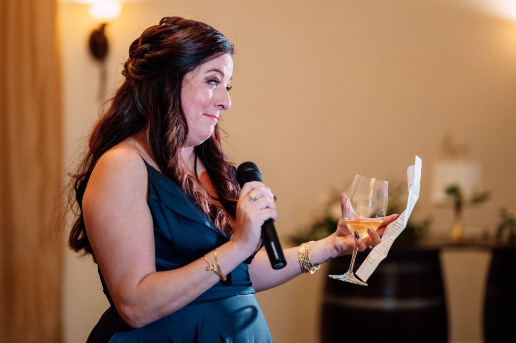 matron of honor gives speech during wedding reception