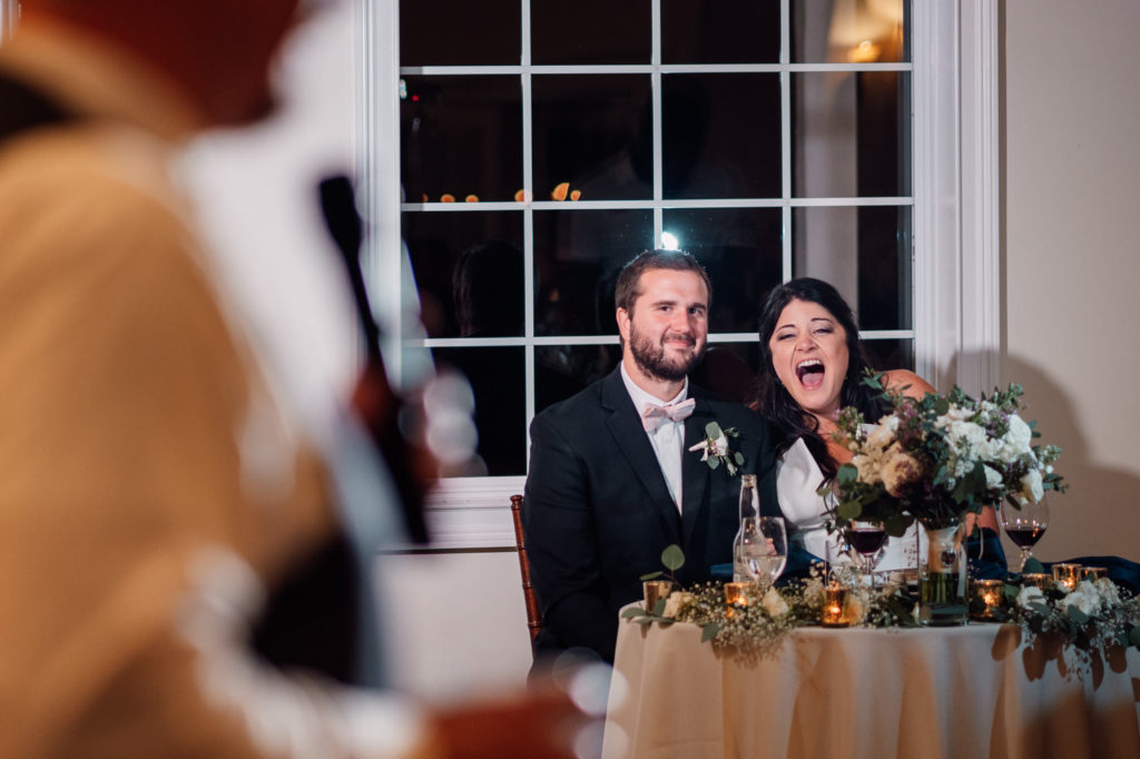 bride and groom laughing during first speeches at leesburg virginia wedding