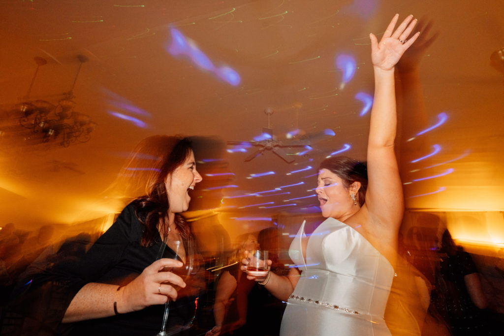 bride dancing with friend during the wedding reception at a Northern Virginia Wedding