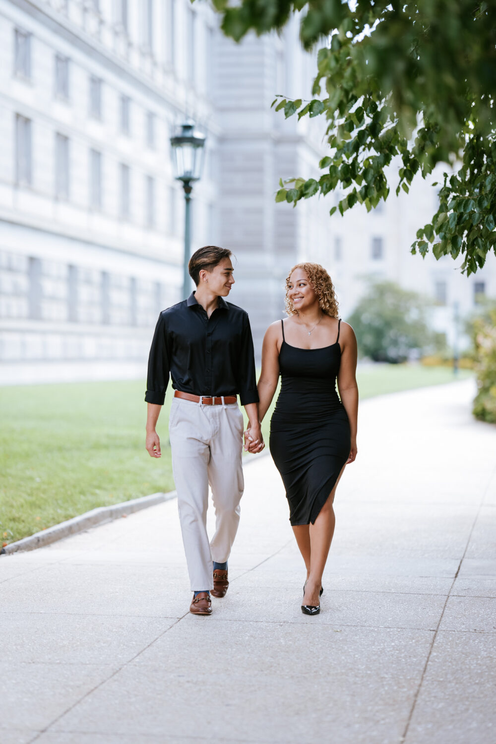 couple walking together during their library of congress engagement session in washington dc