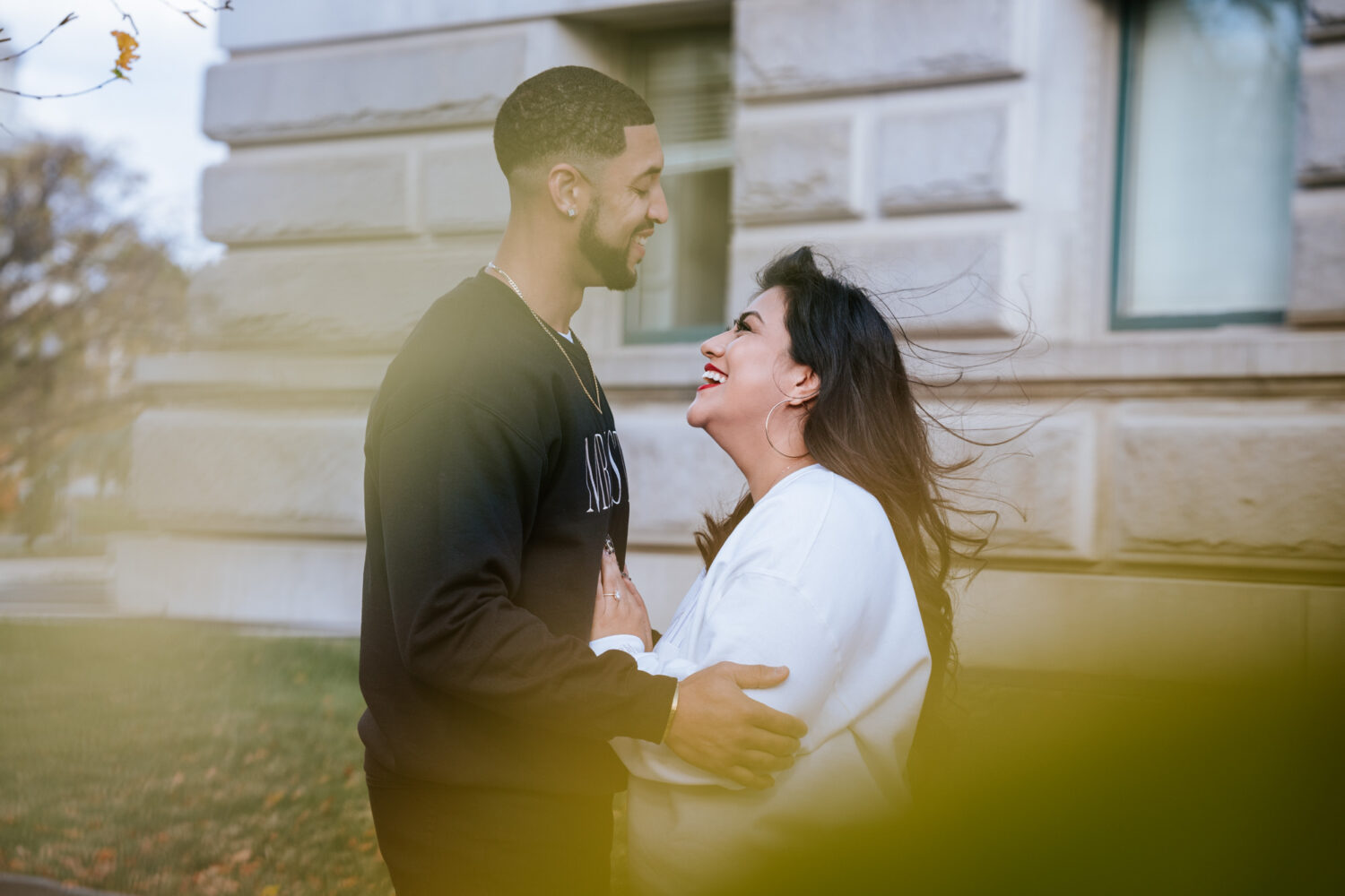 couple cuddling and laughing together