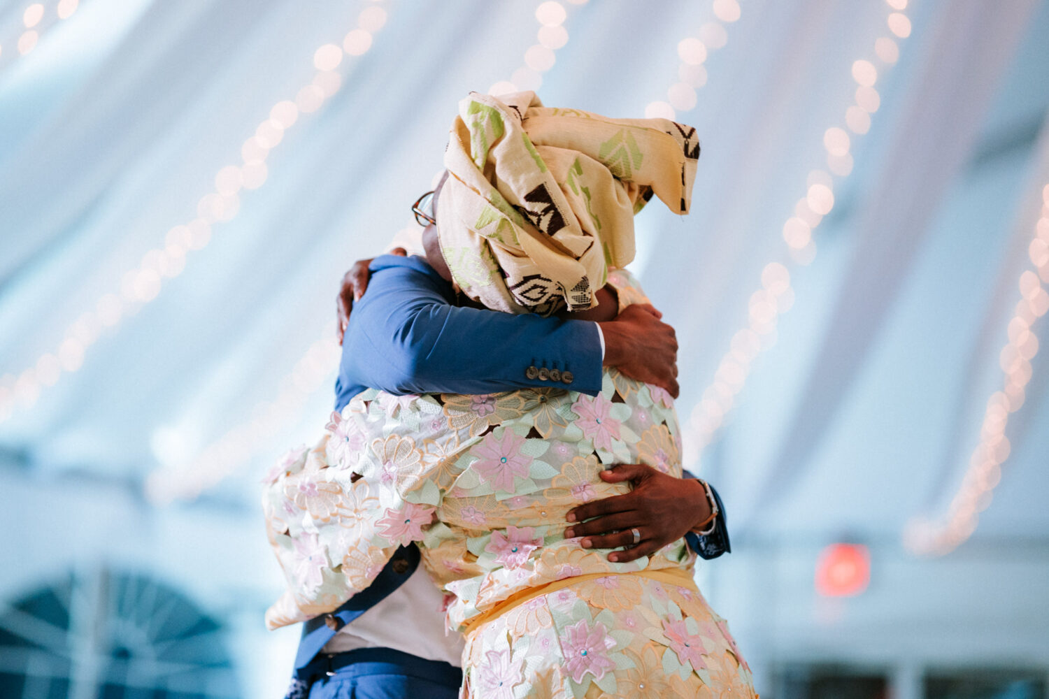 groom and mother hugging after their mother-and-son wedding dance