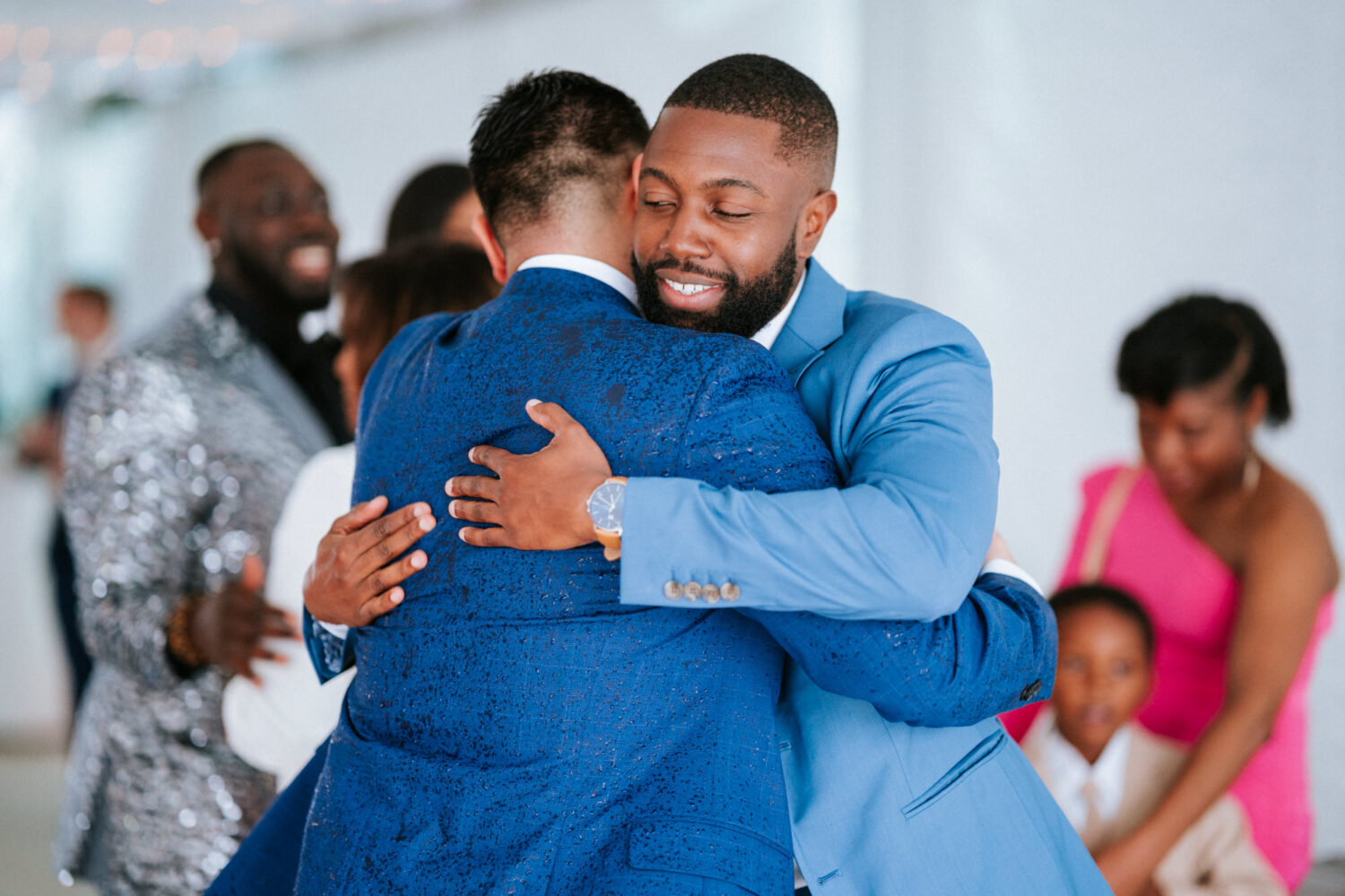groom hugging his best man on his wedding day