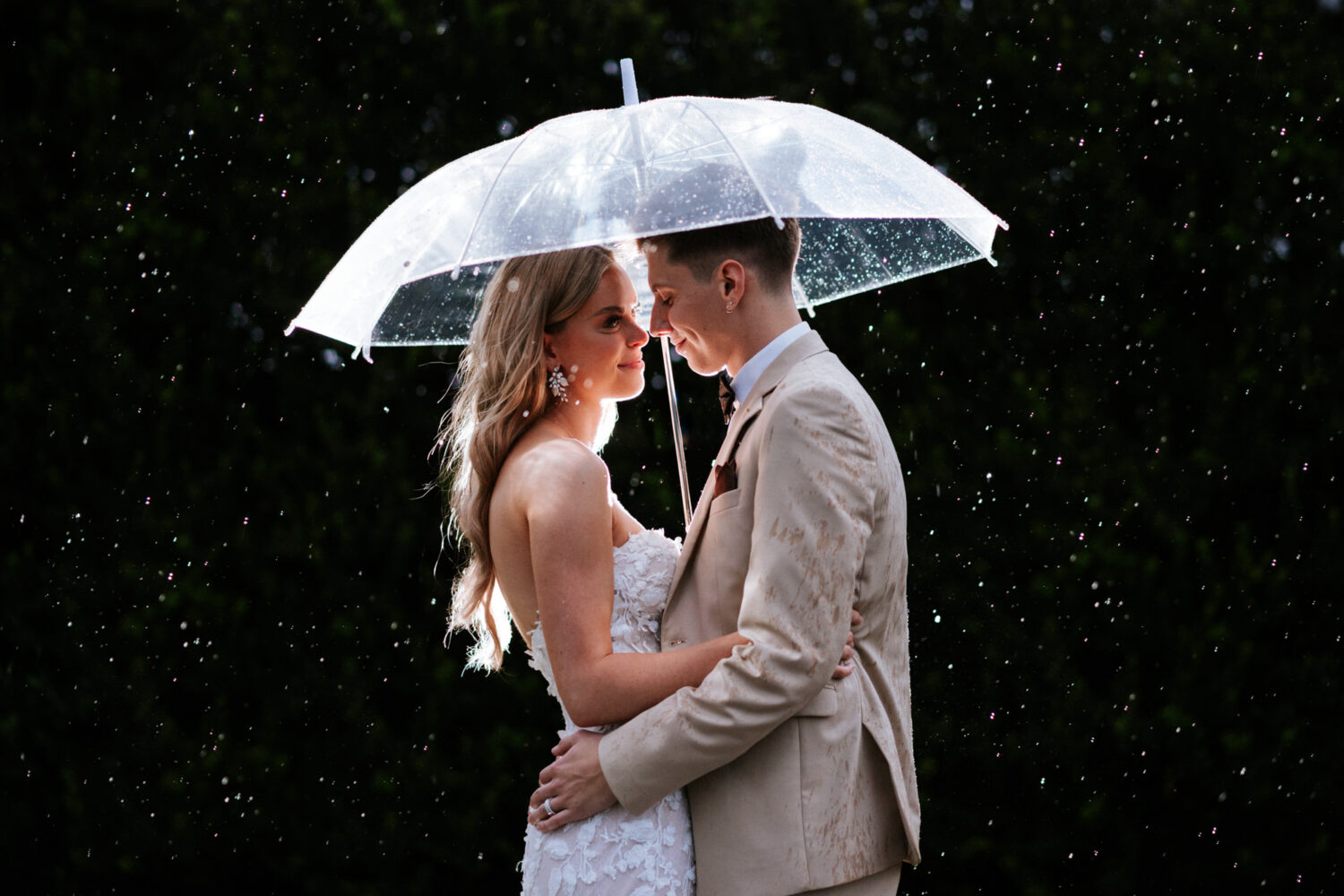bride and groom portrait in the rain on their springfield country club wedding day in northern virginia