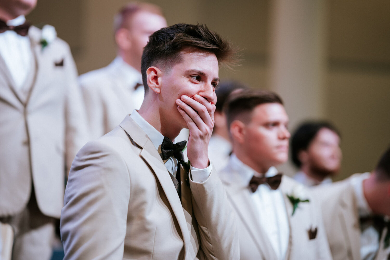 groom reacting to seeing his bride walk down the aisle