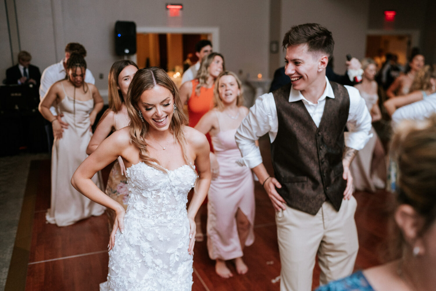 bride and groom having fun on the dance floor together at their springfield country club wedding