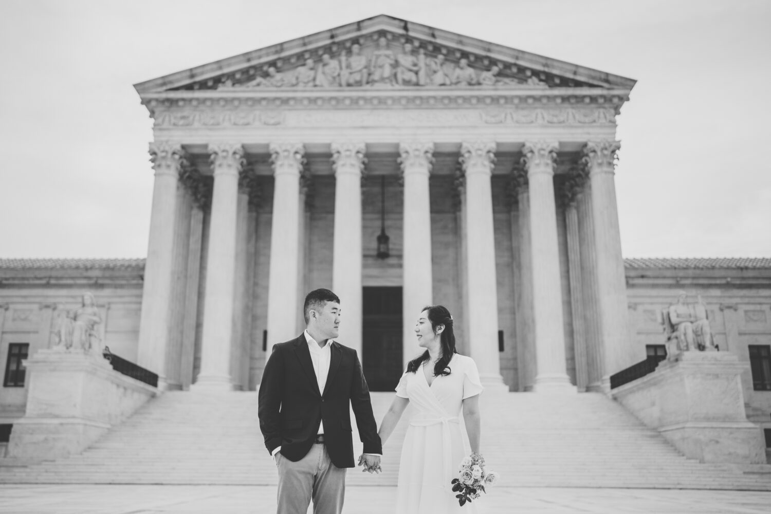 bride and groom looking at each other during their engagement session at the us supreme court in washington dc