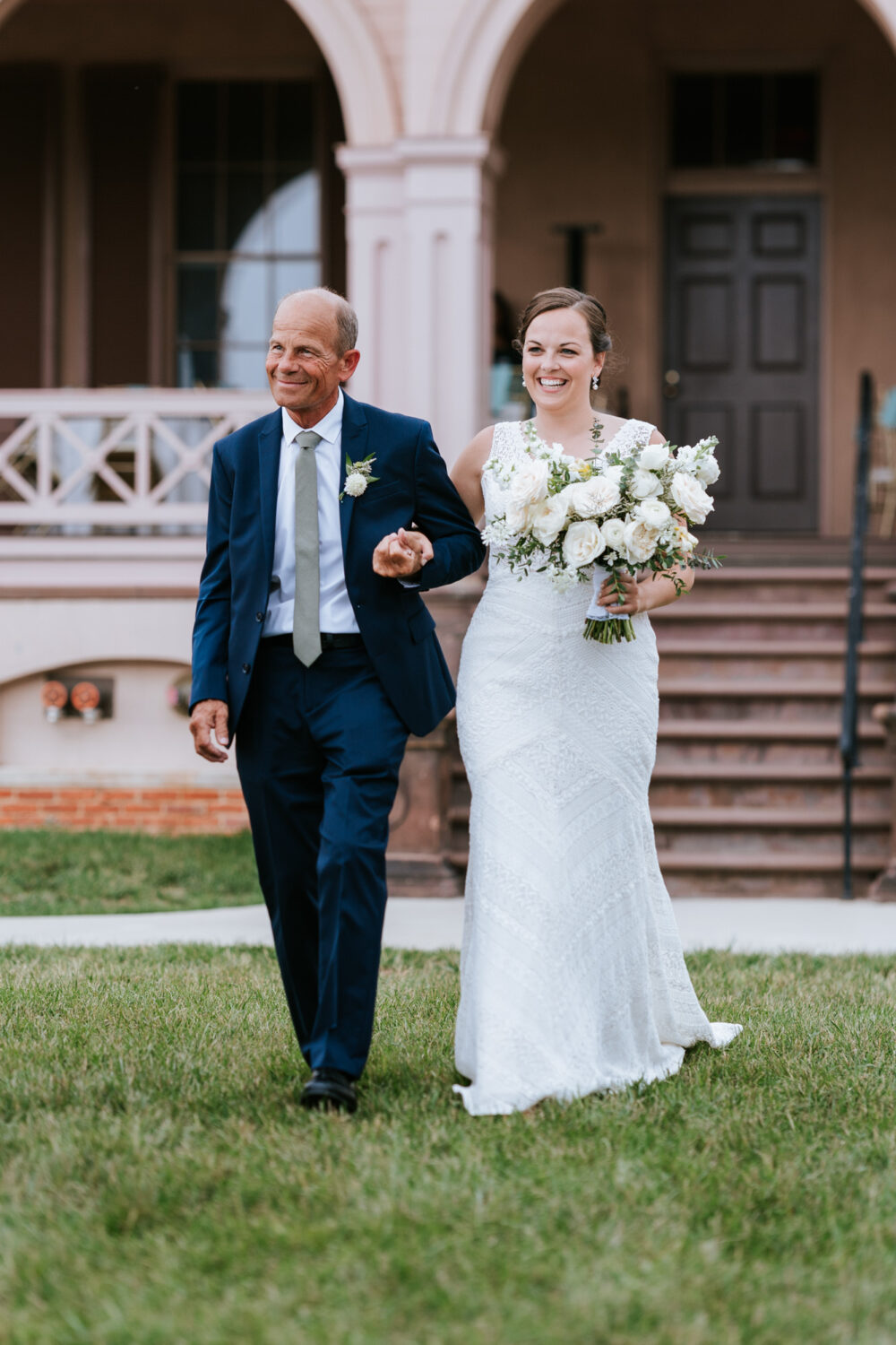 bride and her father walking down the aisle together
