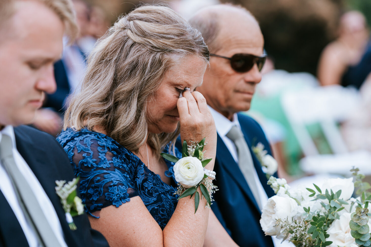 mother of the bride getting emotional during her daughter's wedding ceremony