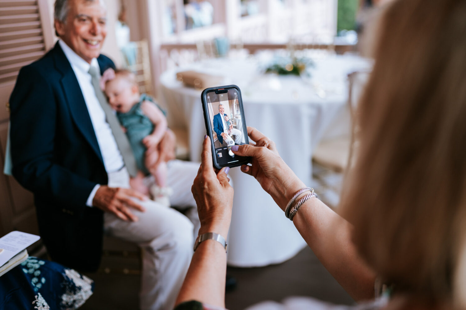 wedding guest taking photo of other wedding guests