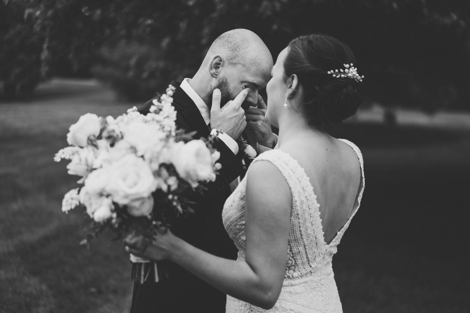 groom gets emotional after seeing bride for the first time on their wedding day