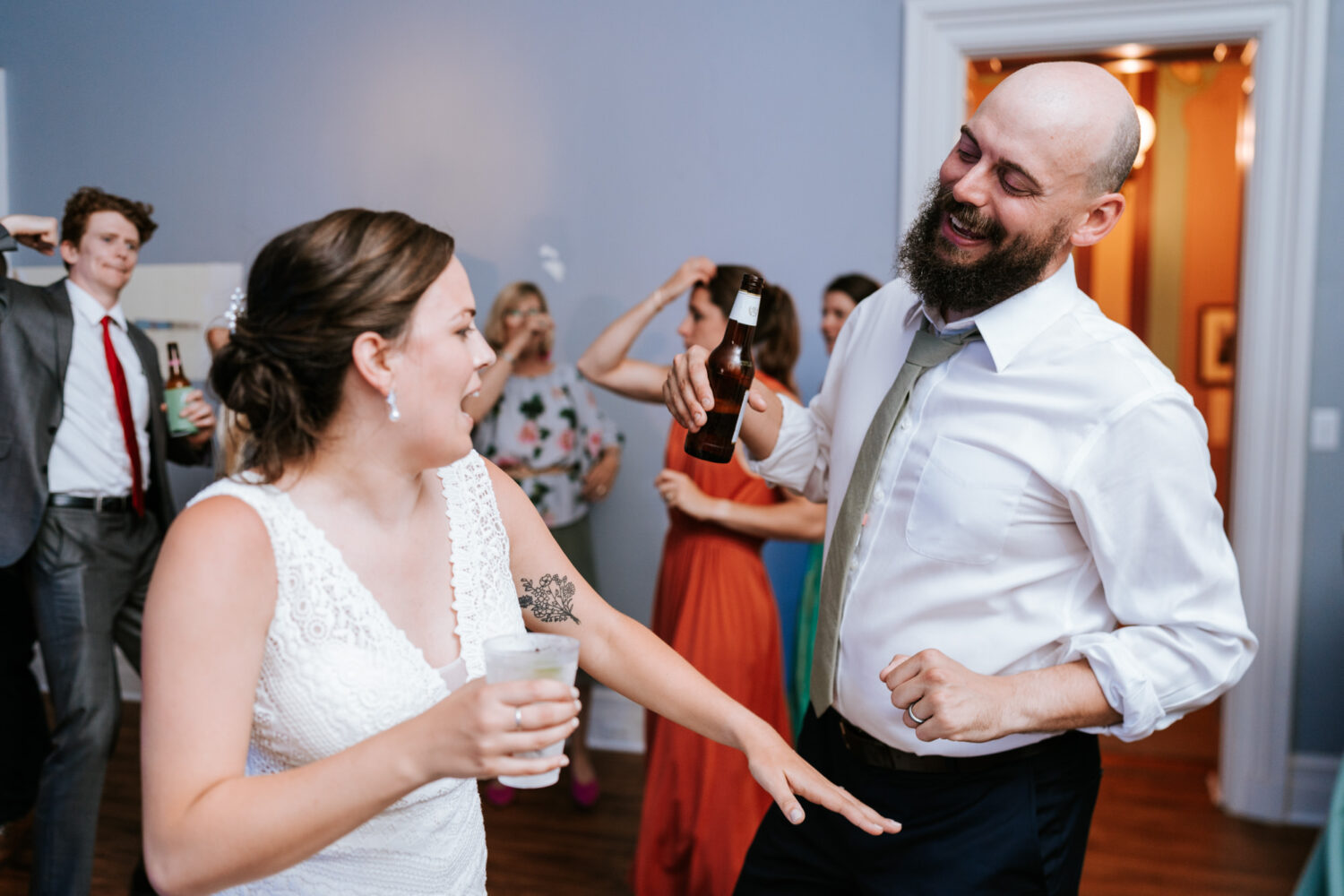 bride and groom dancing together on their wedding day