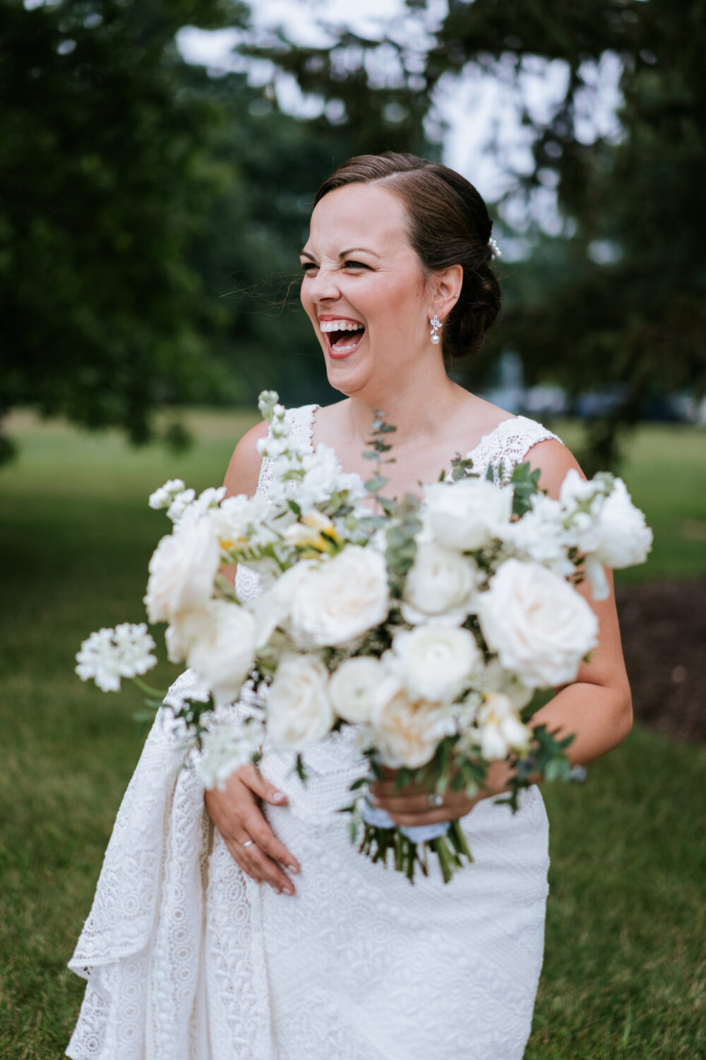 bride laughing and having fun on her wedding day