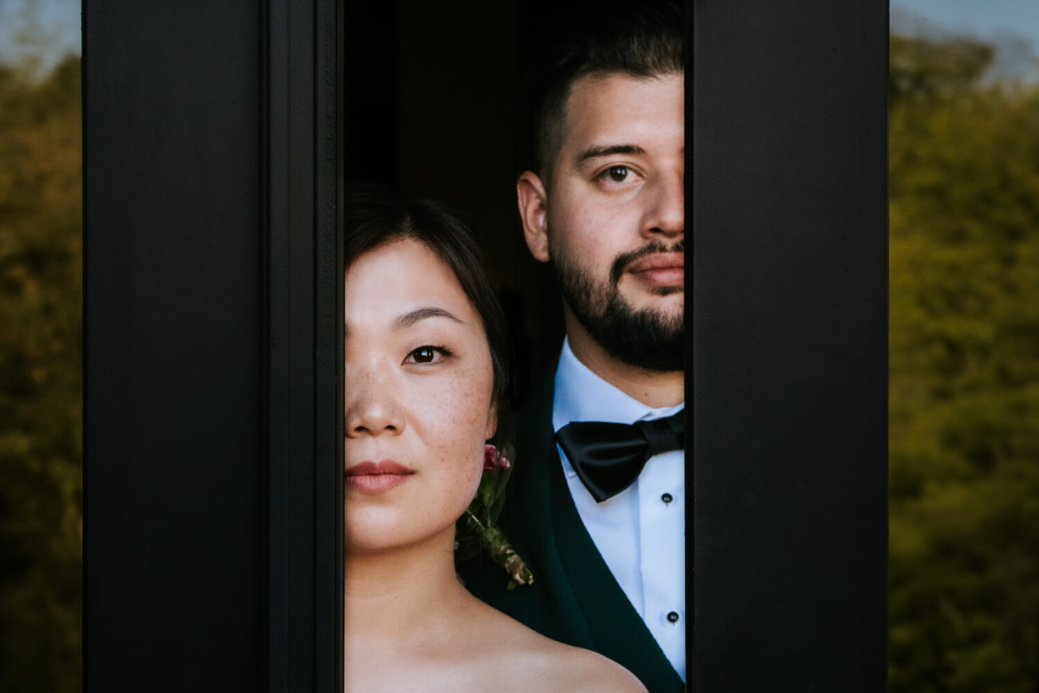 bride and groom looking at camera for a creative portrait at their willow brook wedding day in leesburg, virginia