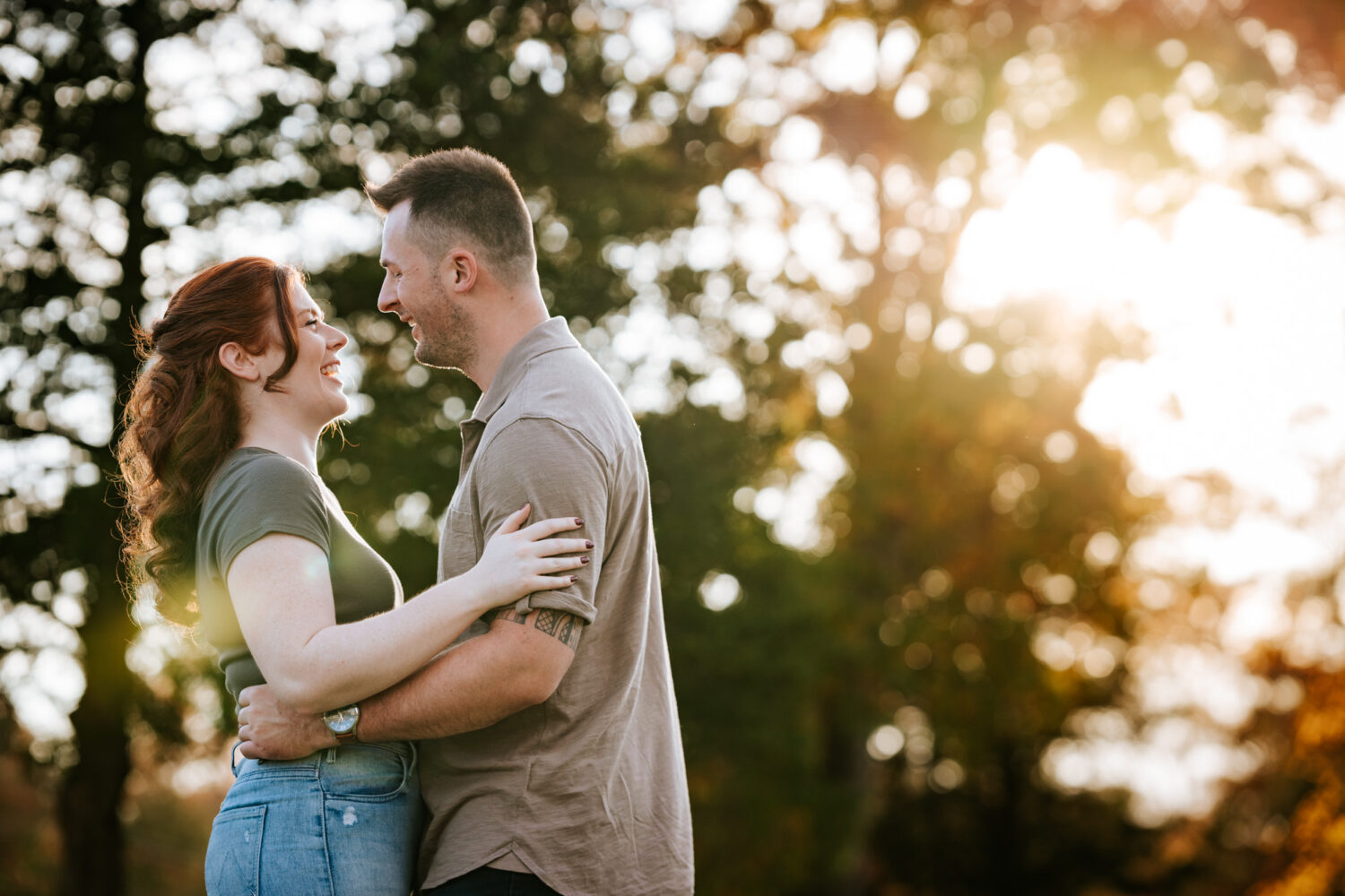 couple laughing together and having fun during their manassas battlefield park engagement session