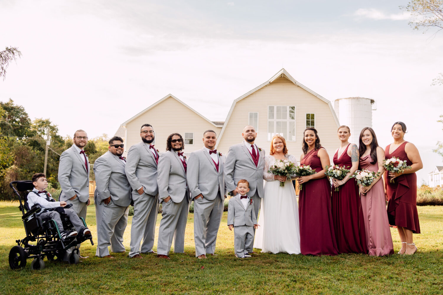 wedding party portrait in front of 48 fields farm