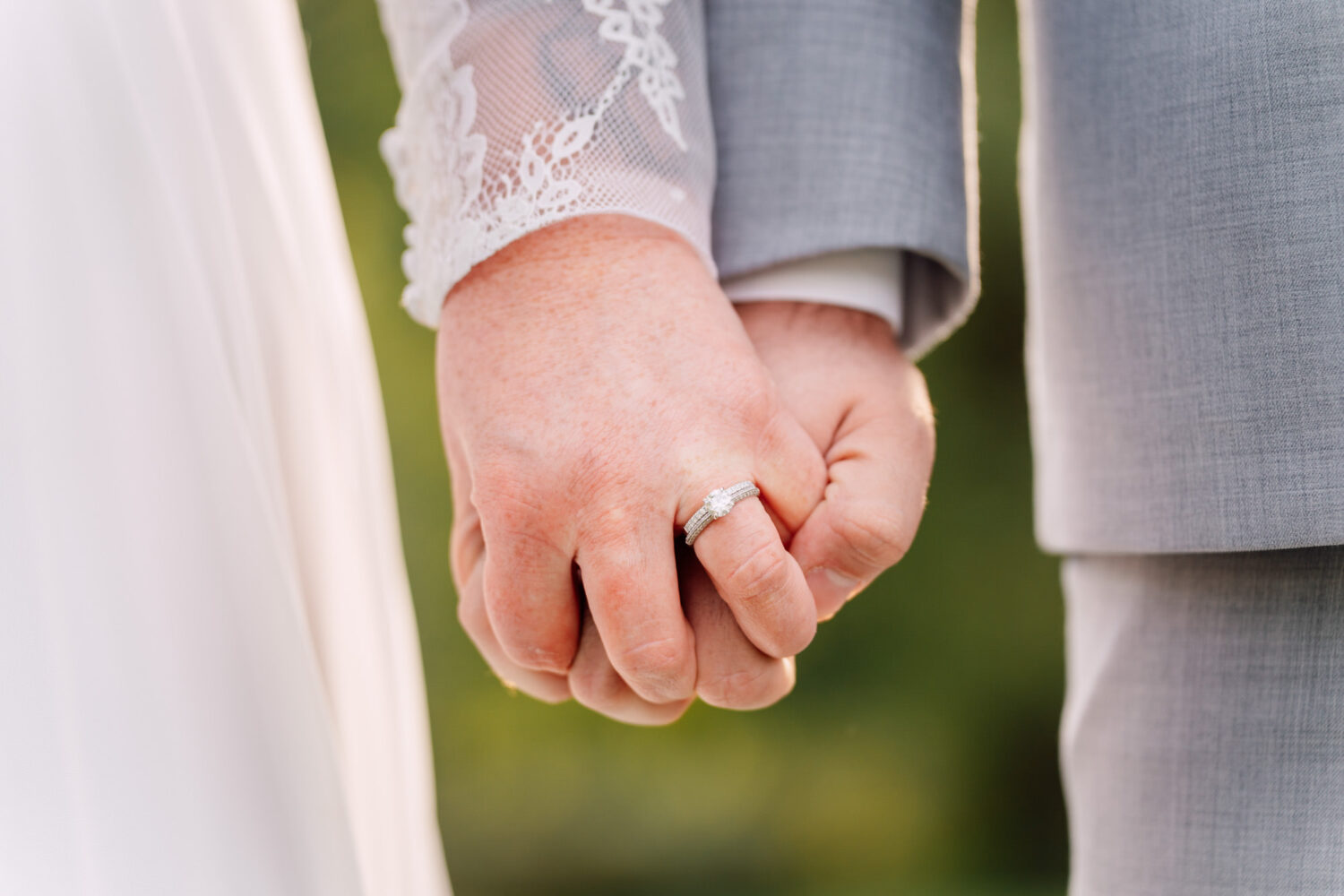 bride and groom holding hands on their wedding day