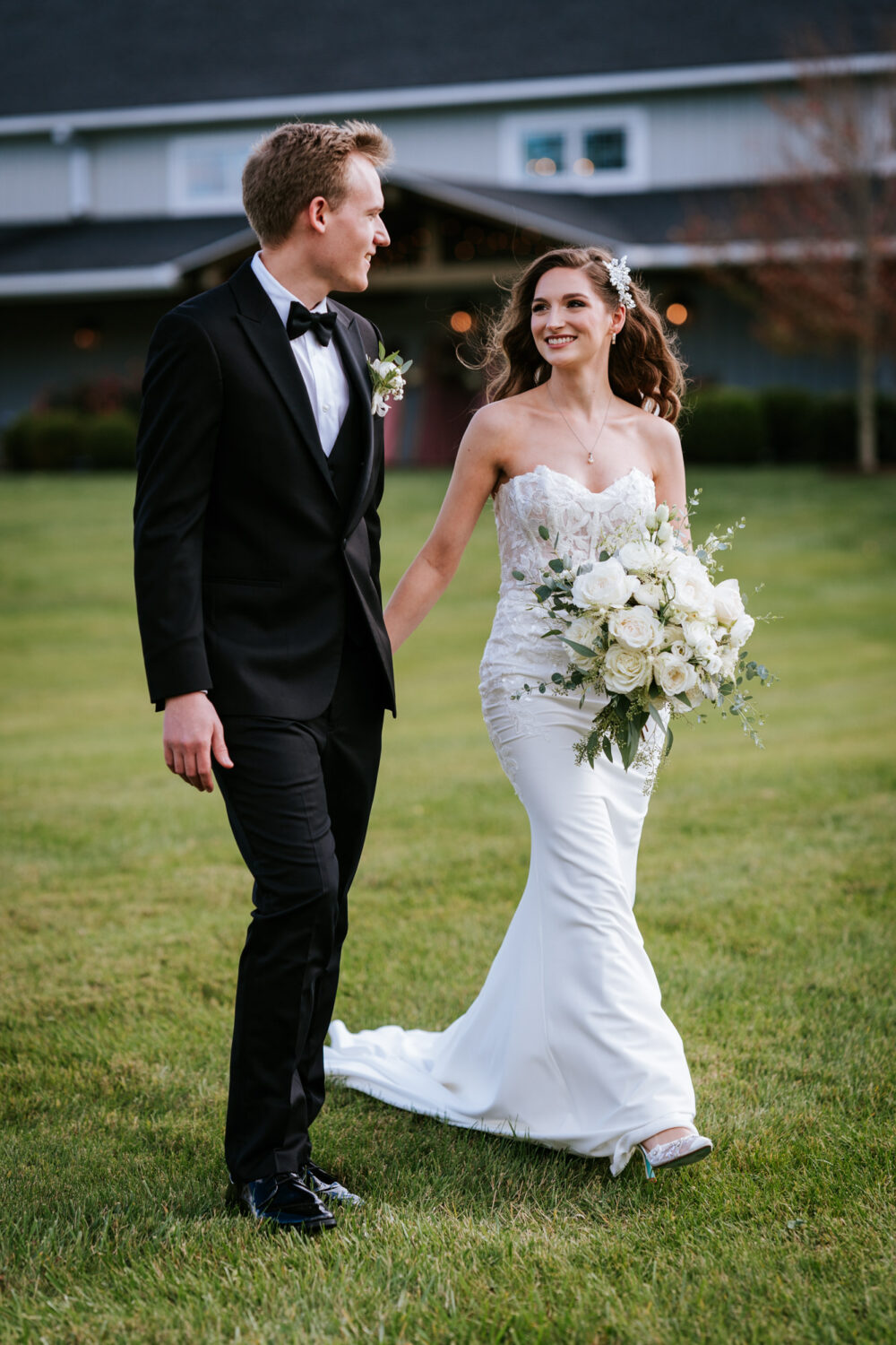 bride and groom walking together on their middleburg barn wedding day