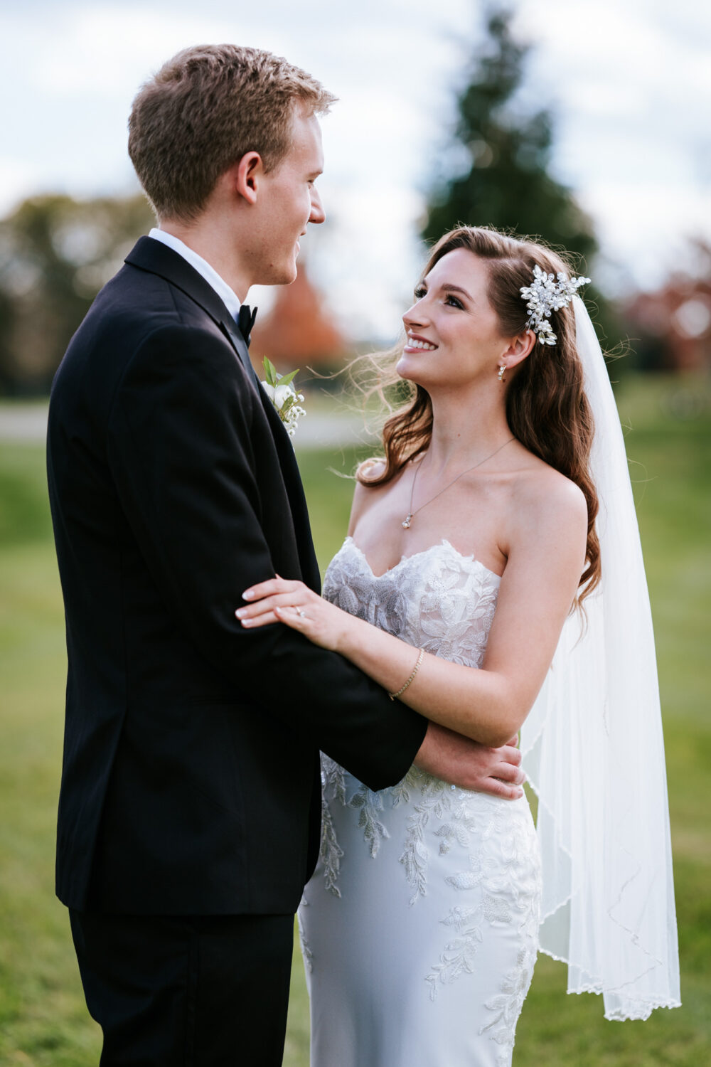 bride and groom looking at each other and smiling together on their wedding day in middleburg va