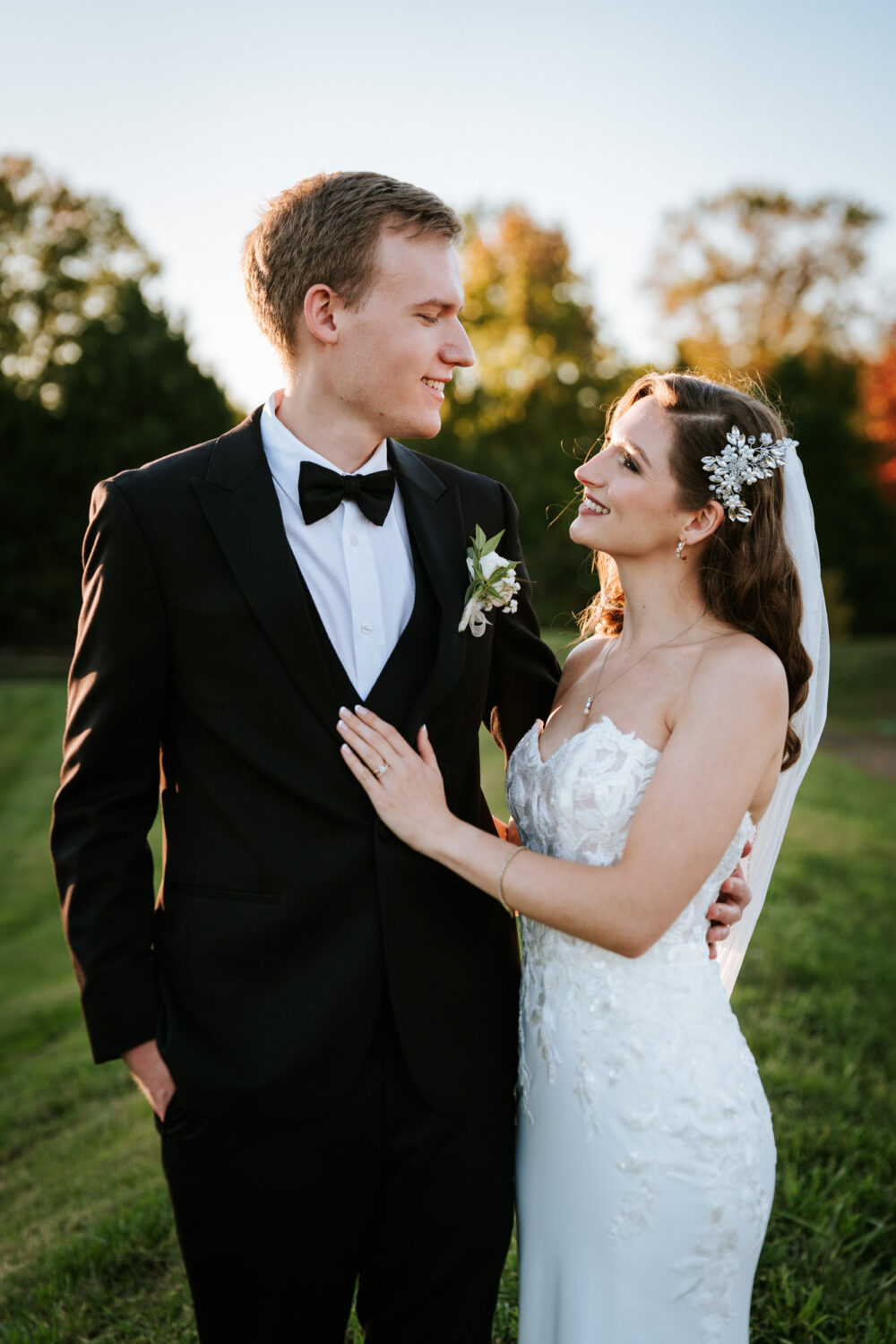bride and groom share a moment together and smile at each other on their middleburg barn wedding day