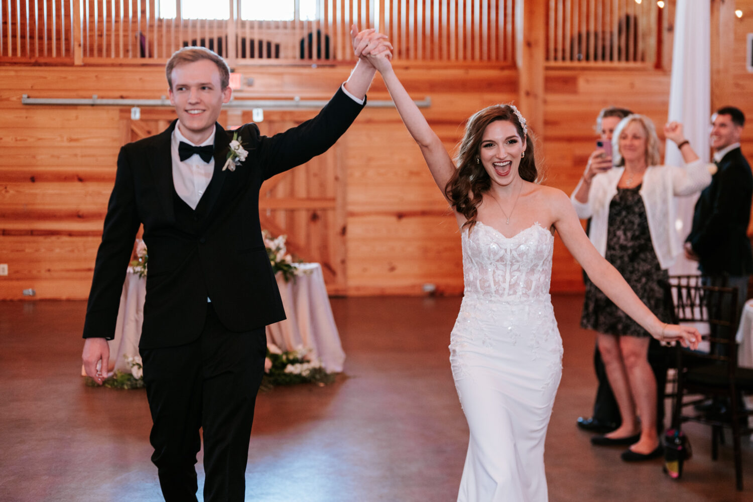 bride and groom walking into their middleburg barn wedding reception together