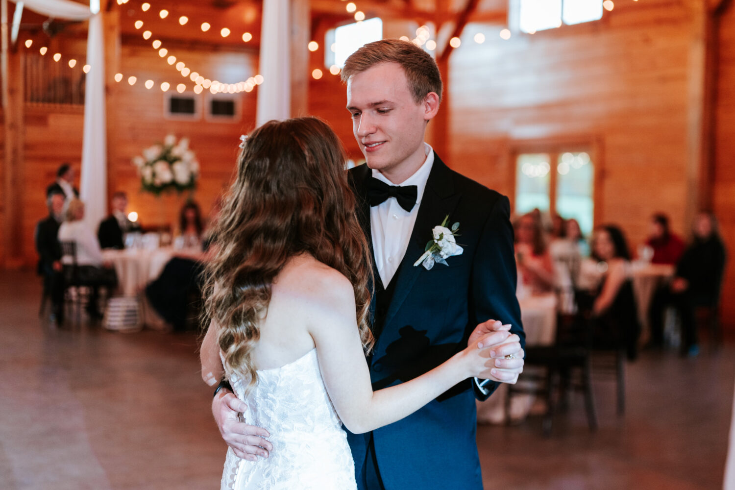 bride and groom doing their first dance together during their middleburg barn wedding
