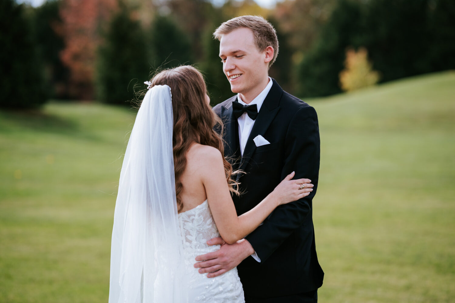 groom happy to see his bride for the first time on their middleburg barn wedding day