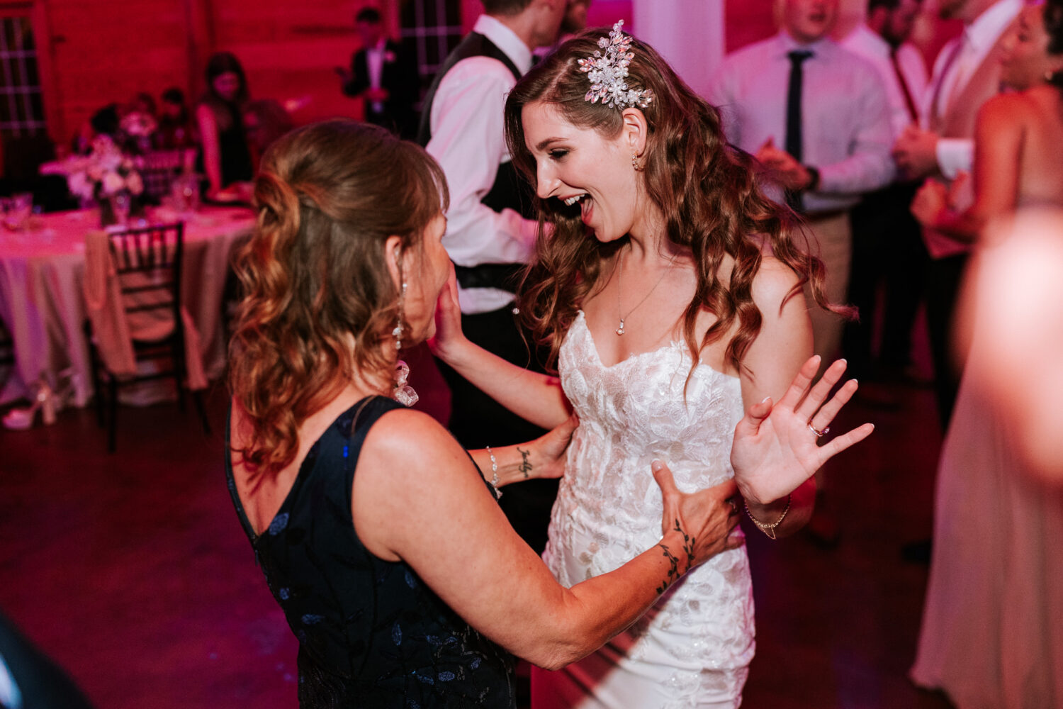 bride having fun on the dance floor with her mother