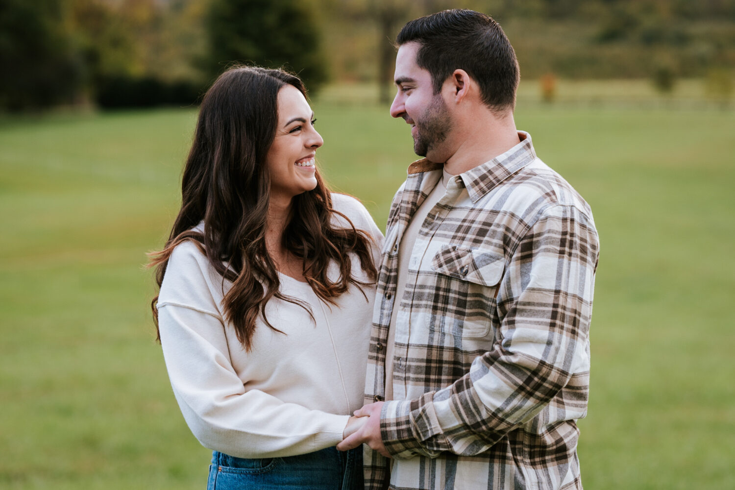 couple laughing together during their engagement session in Morven Park