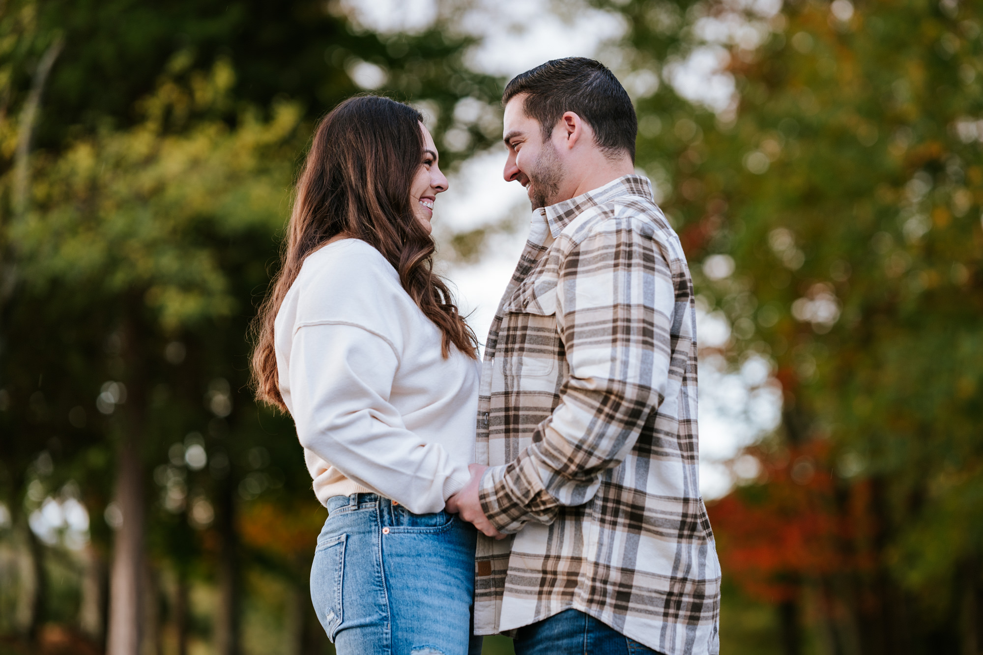 couple holding hands and embracing each other during their engagement session