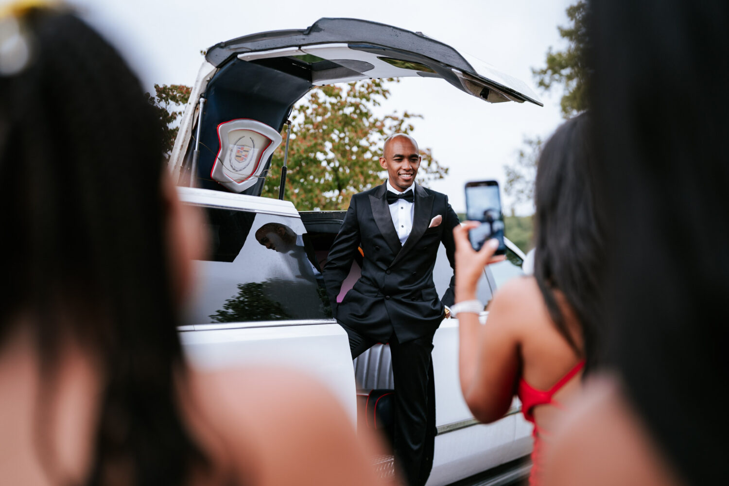 groom getting out of a limousine on his riverside on the potomac wedding day