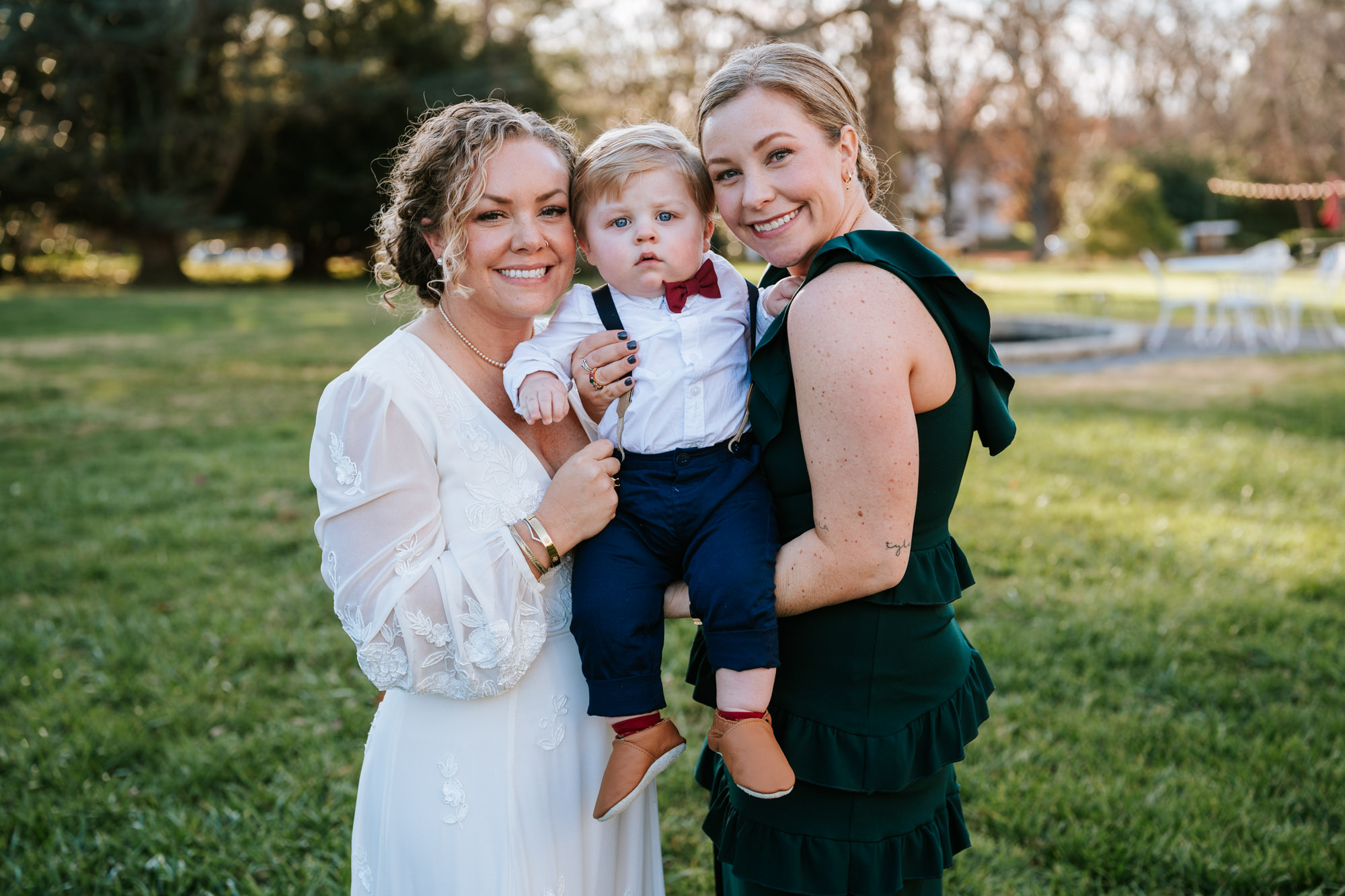 portrait of bride with her baby nephew and sister