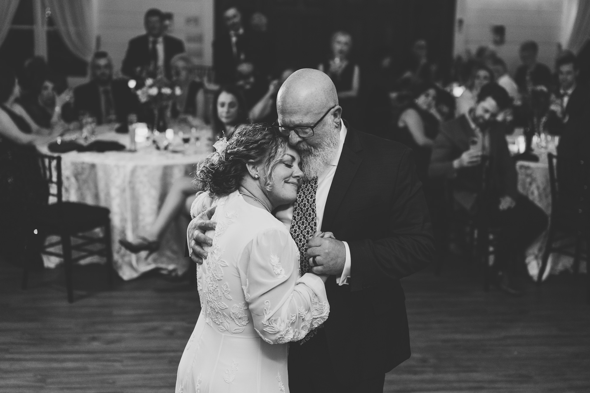 bride and her father dancing together on her wedding day